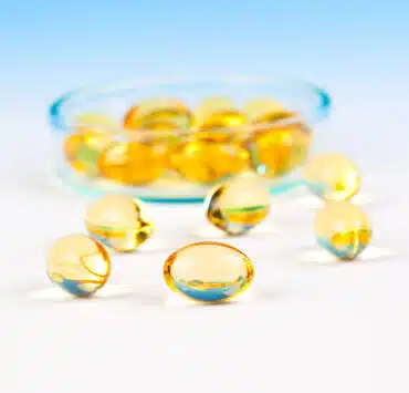 tran dla dzieci w kapsułkach na błękitnym tle