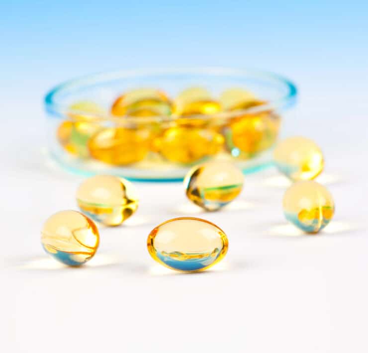 tran dla dzieci w kapsułkach na błękitnym tle